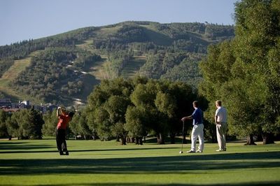 three men playing golf in Utah