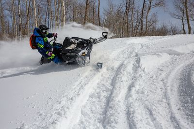 a person riding on a snowmobile